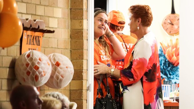 Pauline Hanson consoles a distressed supporter.