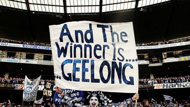 Geelong fans celebrate at the 2009 grand final.