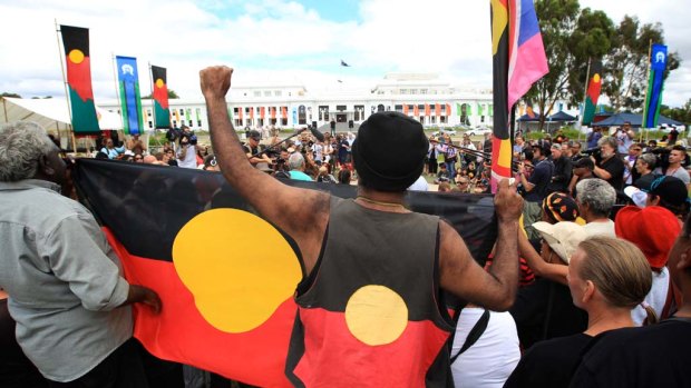 Representatives from the Aboriginal tent embassy deliver a statement to the media in Canberra today.