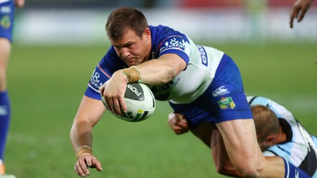 Try time: Josh Morris shows the form that has seen the Bulldogs sign him for another four years.