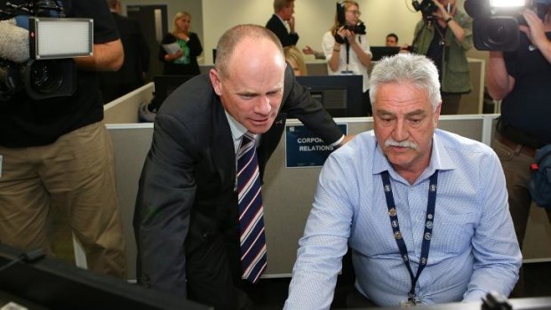 Premier Campbell Newman and Mick Smith, CCTV manager, meet at the G20 operations room at Brisbane Airport.