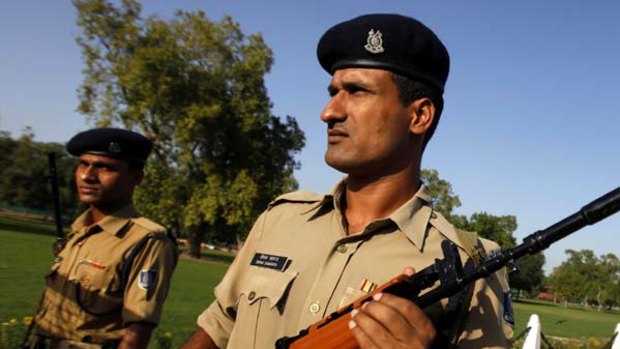 Security personnel stand guard in Delhi.
