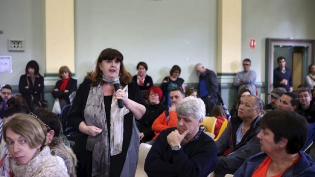 Speaking out: A resident addresses a community meeting held on Sunday about the clean-up efforts after the fatal explosion in Darling Street, Rozelle.
