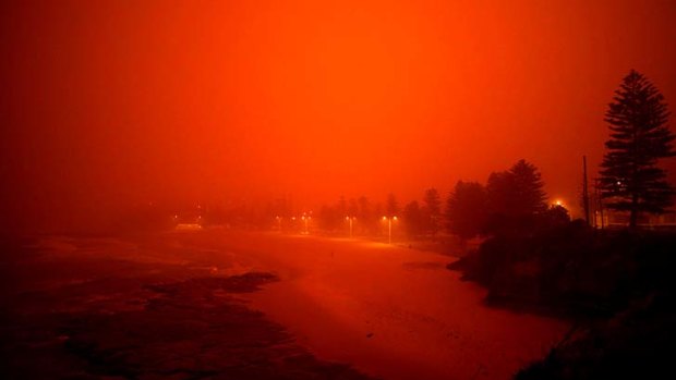 Red sands &#8230; joggers and swimmers on Maroubra beach during the September 2009 dust storm.