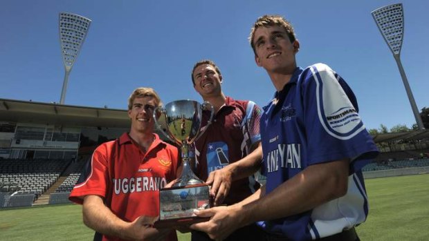 Three of the four teams represented in this weekend's T20 finals pictured at Manuka Oval with the Konica Minolta Cup. Left to right: Michael Barrington, captain of Tuggeranong, Ethan Bartlett, captain of Wests UC and Dean Solway, a Queanbeyan batsman.