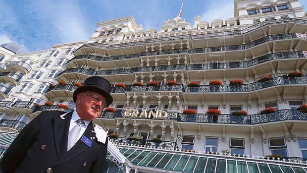 Concierge in front of the Grand Hotel.