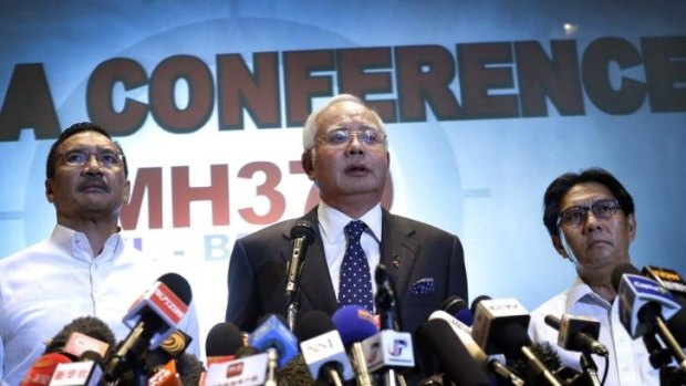 Malaysian Prime Minister Najib Razak, centre, addresses the media.