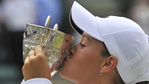 Sealed with a kiss ... Ashleigh Barty after winning the final round girls' match against Irina Khromacheva, of Russia, at Wimbledon.