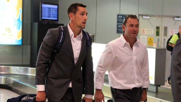 Back on home turf ... the NSW Origin team coach Ricky Stuart and player Mitchell Pearce arrive at Sydney Airport yesterday after Wednesday’s game, which Queensland won after a controversial try.