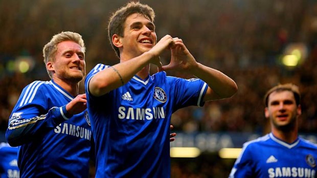 Oscar of Chelsea celebrates scoring the first goal.