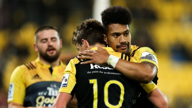 In the bag: Ardie Savea of the Hurricanes congratulates Beauden Barrett on his try.