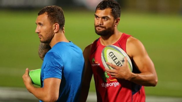 Let's get physical: Quade Cooper (left) with Karmichael Hunt at Reds training last week.