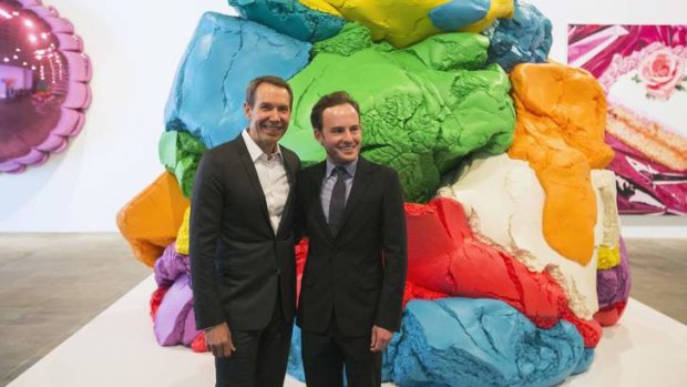 Jeff Koons (left) poses in front of his creation <i>Play-Doh</i> with the Whitney's Scott Rothkopt.