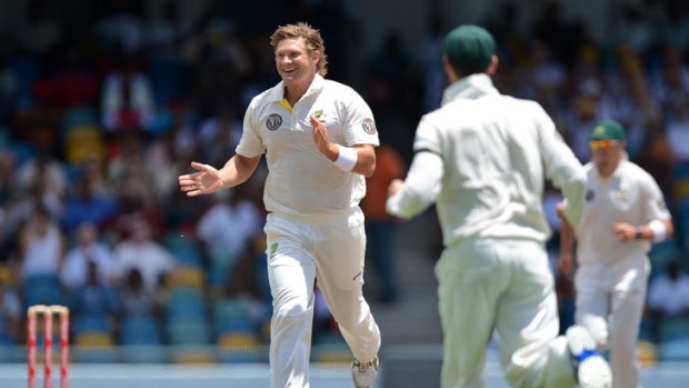 Australian cricketer Shane Watson celebrates the wicket of West Indies batsman Darren Bravo on the second day of the First Test.