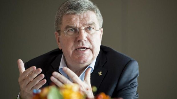 International Olympic Committee President Thomas Bach speaks with journalists after a round table with athletes.