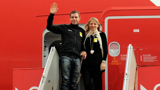 Tour de France 2011 winner Cadel Evans and his wife Chiara arrive at Tullamarine airport this morning.