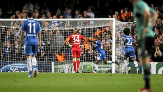 Samuel Eto'o celebrates after scoring the first goal past Schalke goalkeeper Timo Hildebrand.