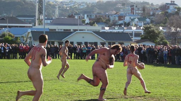 Bare aggression ... players take on the cold as well as each other at the annual Nude Rugby Test.