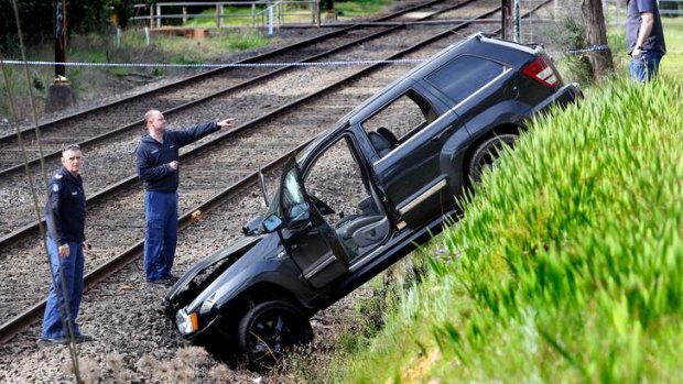 Police shot at this Jeep Cherokee before it went down an embankment between Croydon and Mooroolbark stations. The two men in the car were arrested.