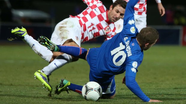 Tussle: Iceland's Gylfi Thor Sigurdsson and Croatia's Dario Srna compete for the ball their 0-0 draw.