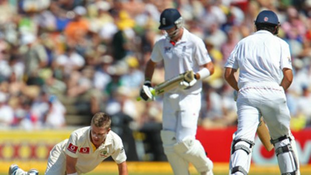 Xavier Doherty can only look away as Alastair Cook and Kevin Pietersen run between the wickets in Adelaide yesterday.