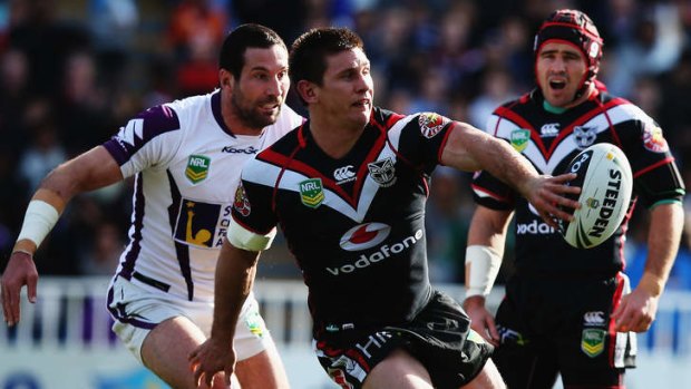 Black magic: Jacob Lillyman offloads in the Warriors' thrilling victory over the Storm.