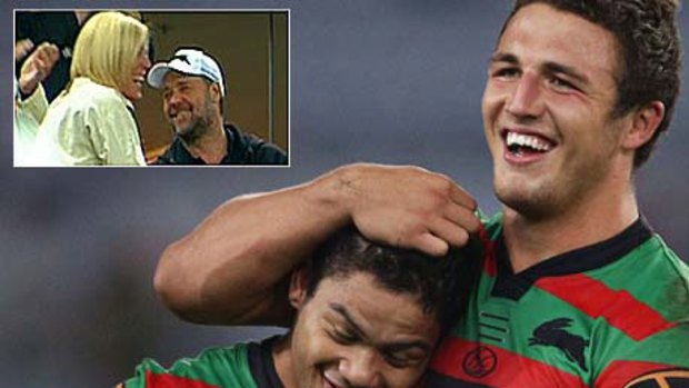 Time to celebrate ... try-scorers Issac Luke (one) and Sam Burgess (two) after Souths’ win. Inset: Julie Burgess with Russell Crowe.