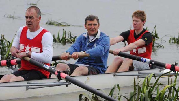 John Brumby (centre) rows with the Wendouree Ballarat Rowing Club. He announced a plan to attract sporting and arts events to regional Victoria.