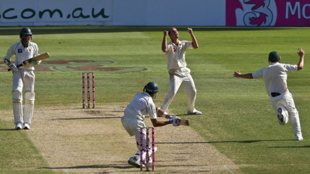 Nathan Hauritz celebrates after dismissing Umar Gul as Australia wins the second Test.