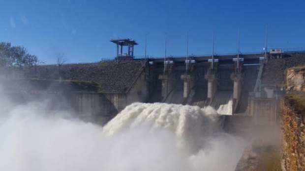 Water surges out of Wivenhoe Dam after recent heavy rain.