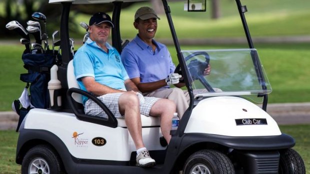 Golfing buddies: Barack Obama and John Key on the course in Hawaii.