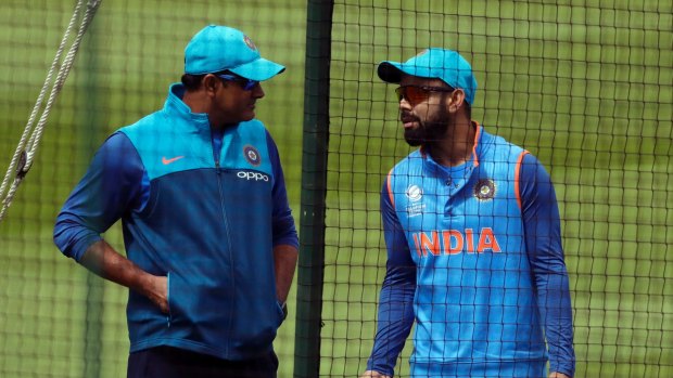 Rift: India's captain Virat Kohl, right, speaks with head coach Anil Kumble.