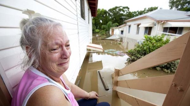 "At least we are safe and our kids are safe" ... Anne Smart back at her two-storey house in Ipswich.