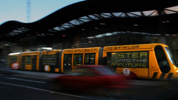 Flight of the Bumblebee: One of the new No. 96 trams passes Southern Cross Station. PICTURE: JUSTIN McMANUS