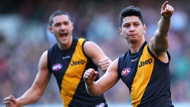 Robin Nahas of the Tigers celebrates kicking a goal during the round 15 AFL match between the Melbourne Demons and the Richmond Tigers at the Melbourne Cricket Ground.