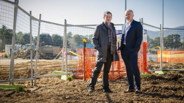 Retired Australian players Todd Woodbridge and Wally Masur inspect the work on the new tennis facility at Lyneham on Monday.