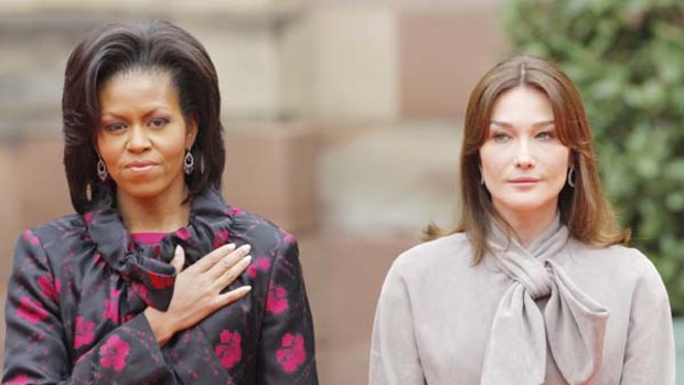 Michelle Obama stands with Carla Bruni-Sarkozy at Palais Rohan in Strasbourg.