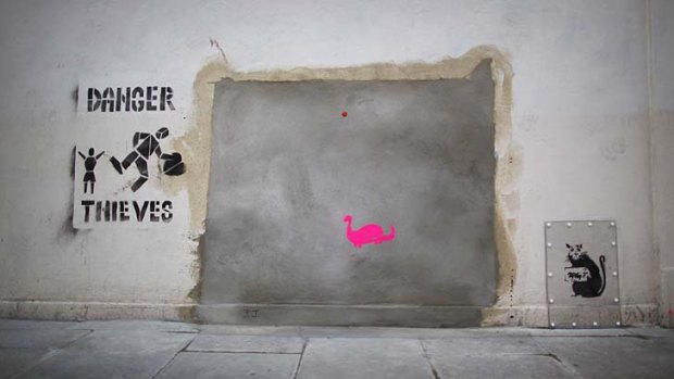 Stolen? ... a new stenciled rat and "Danger Thieves" appears where the old Banksy artwork was removed.
