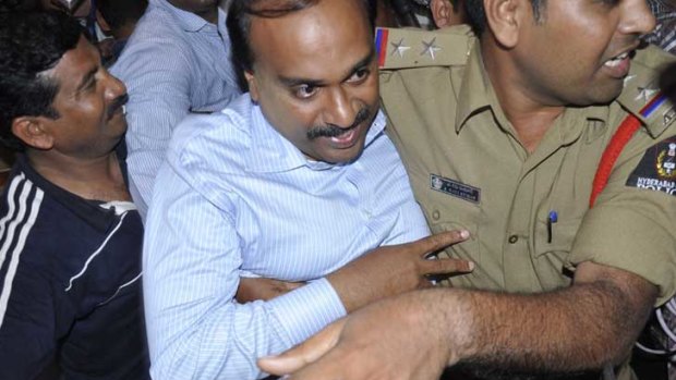 Police escort mining baron and former Karnataka state minister Janardhana Reddy to jail in Hyderabad.