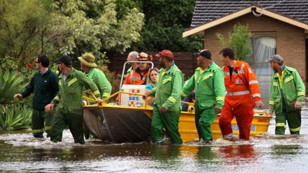 SES volunteers help residents from their flooded homes in Irymple.