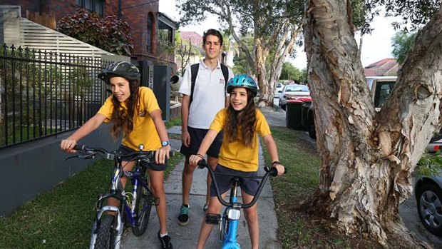 Road to good health: Oliver McCue, 15, walks to school while sisters Mia, 12, and Jenna, 10, cycle from their home in Bondi.