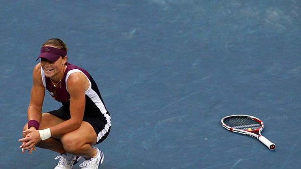 Samantha Stosur of Australia reacts after defeating Serena Williams.