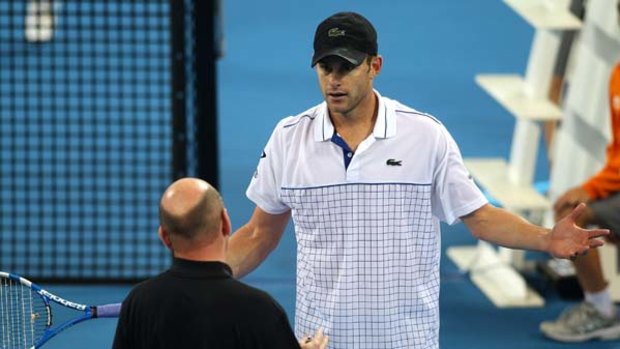 Andy Roddick debates with the chair umpire in his finals match against Robin Soderling at the Brisbane International.