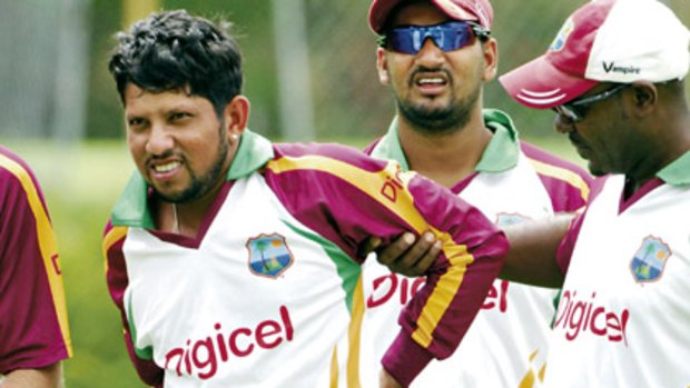 In doubt . . . class West Indies batsman Ramnaresh Sarwan leaves the training field after injuring his back yesterday.