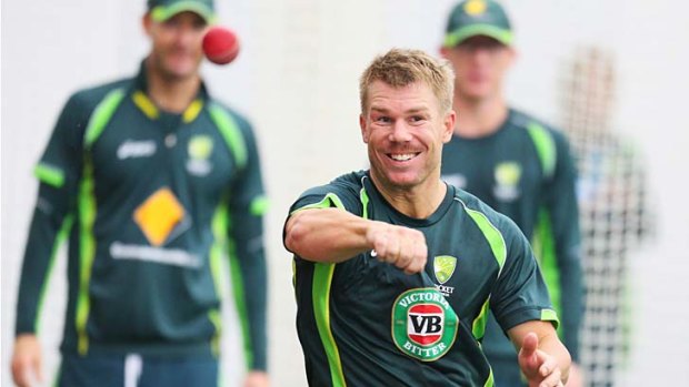 David Warner is watched by Michael Clarke and Chris Rogers at training.