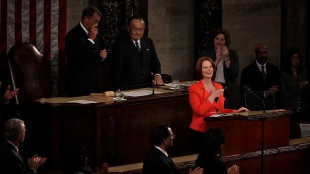 The Speaker of the House John Boehner wipes away a tear  as Australia Prime Minister Julia Gillard places her hand on her heart during a standing ovation following her address to a Joint Meeting of Congress in Washington DC.