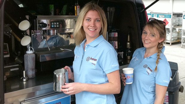 Gemma Schiebling (left) and Karla Cavalli whip up some coffees at Lifeline's Bean Talkin' coffee cart.