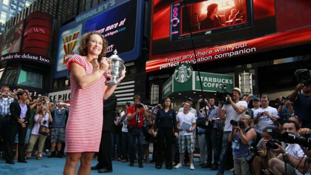 Time to celebrate ... Samantha Stosur is all smiles with her US Open trophy in New York's Times Square.