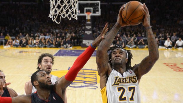 Los Angeles Lakers centre Jordan Hill puts up a shot as Detroit Pistons counterpart Andre Drummond.