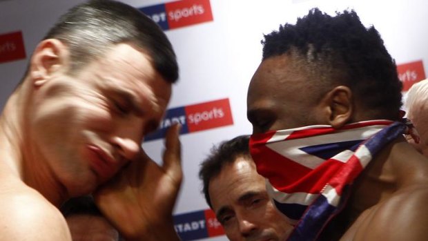 Slap in the face ... British boxer Dereck Chisora hits Vitali Klitschko in the face.